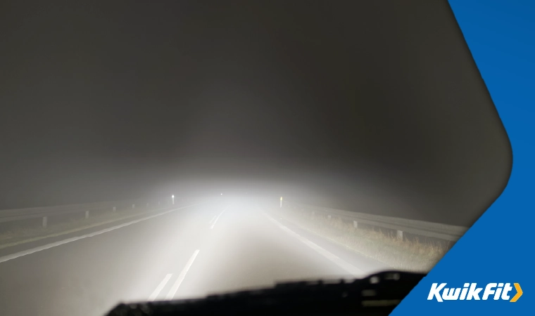 Headlights on full beam in the fog